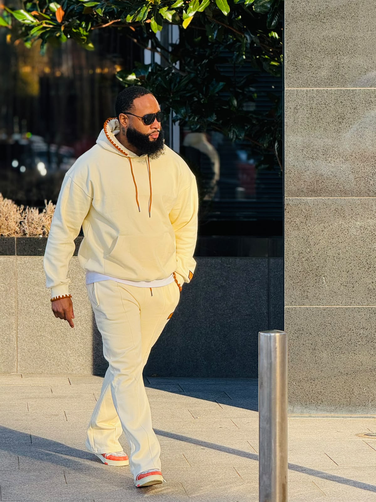 Model wearing the SOLMA Signature Tracksuit on a Dakar street
